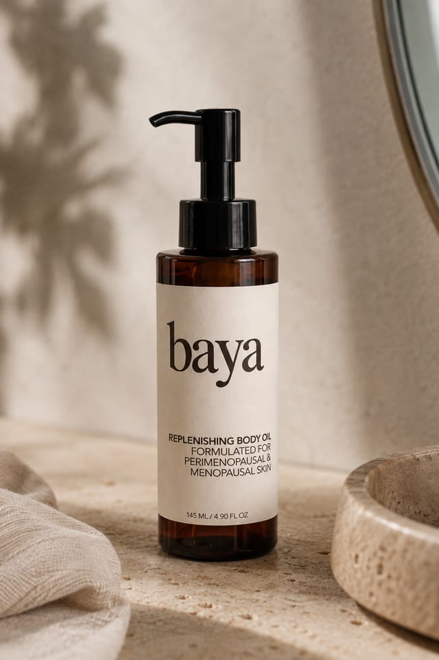 Baya Replenishing Body Oil bottle styled on linen